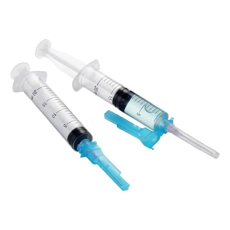Safety syringe with retractable needle
